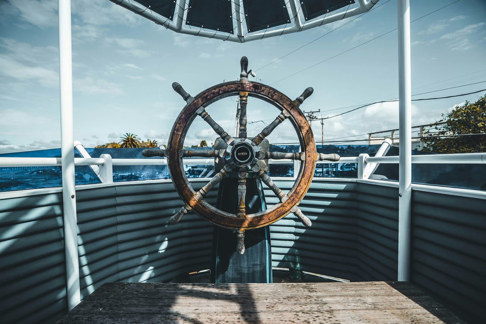 A ship's wheel viewed head-on aboard a vessel